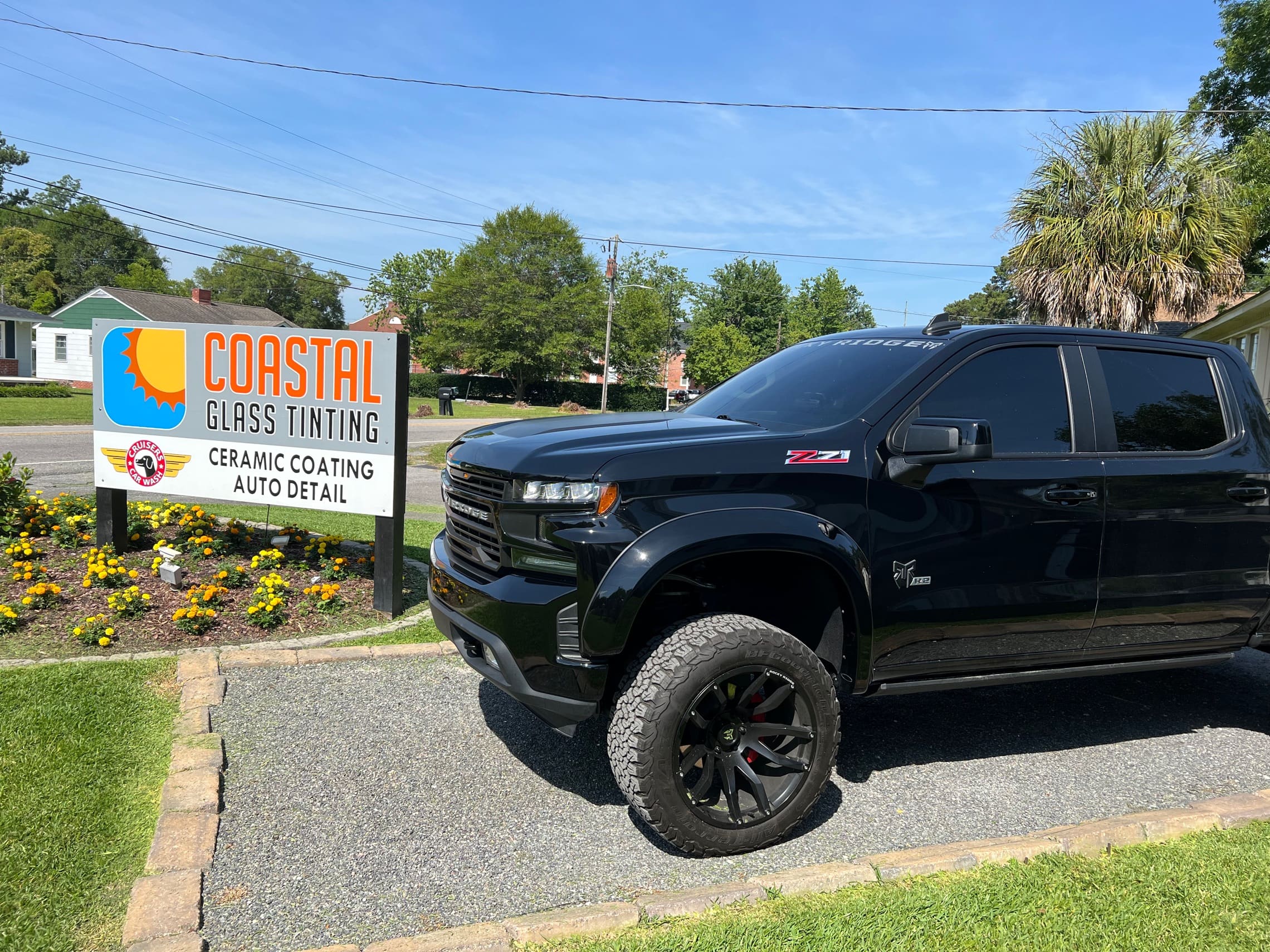 Coastal Glass Tinting vehicle and storefront